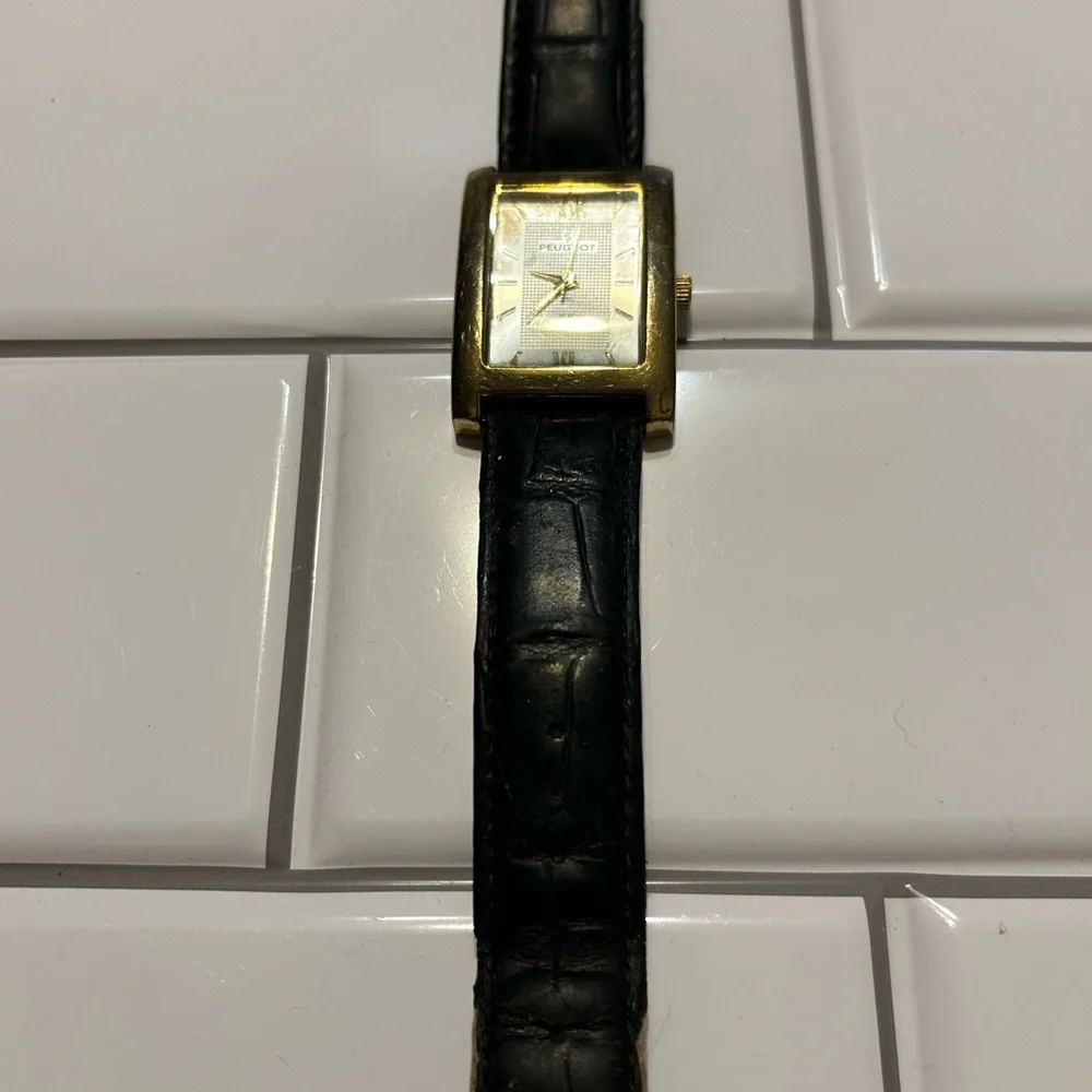 Peugeot Gold and Black Timepiece